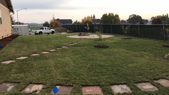 Large backyard with new sod and patio area